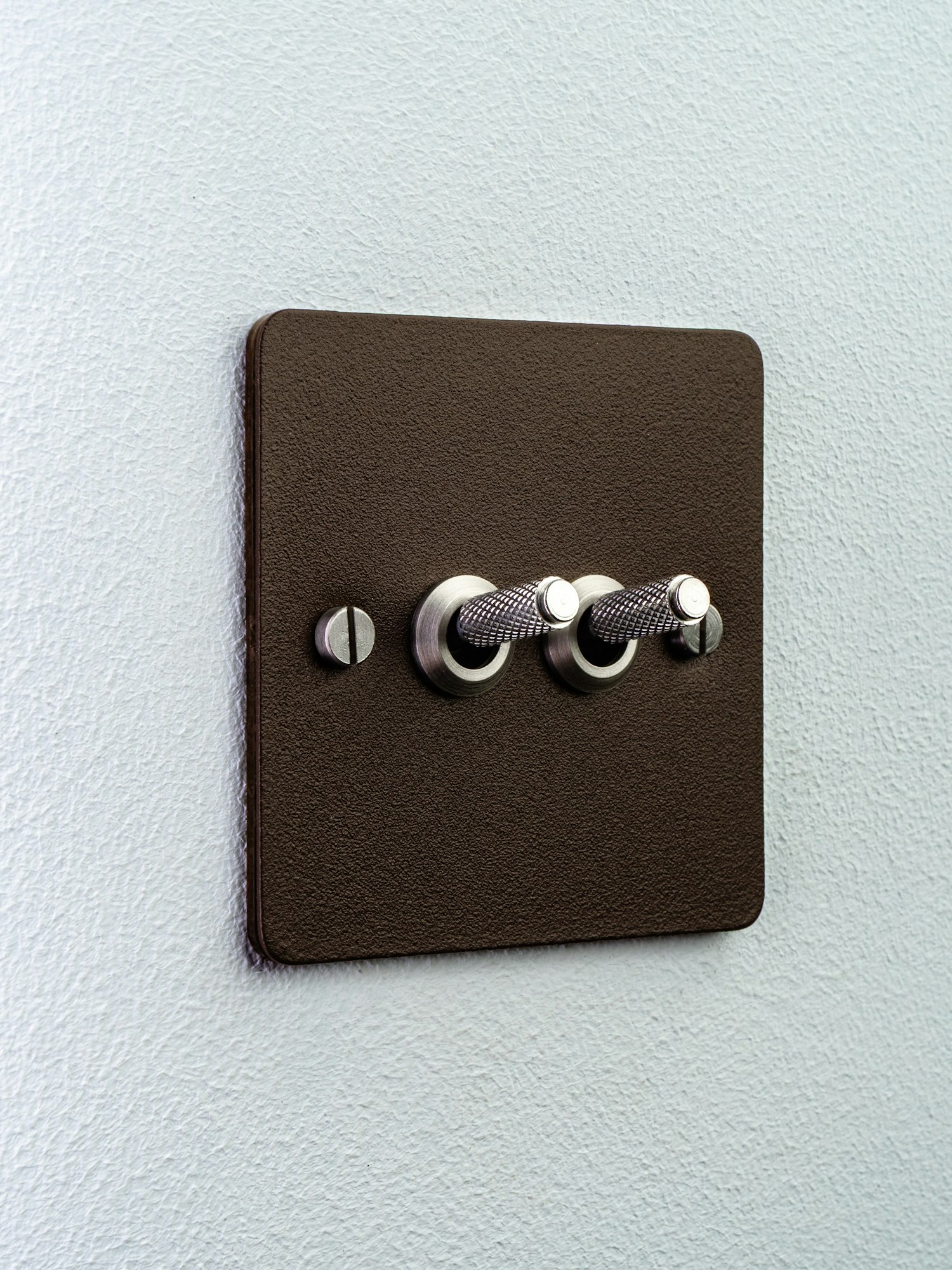 Dark metal light switch